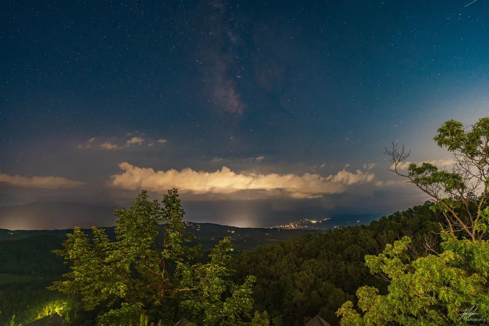 Clouds glowing over a valley at twilight