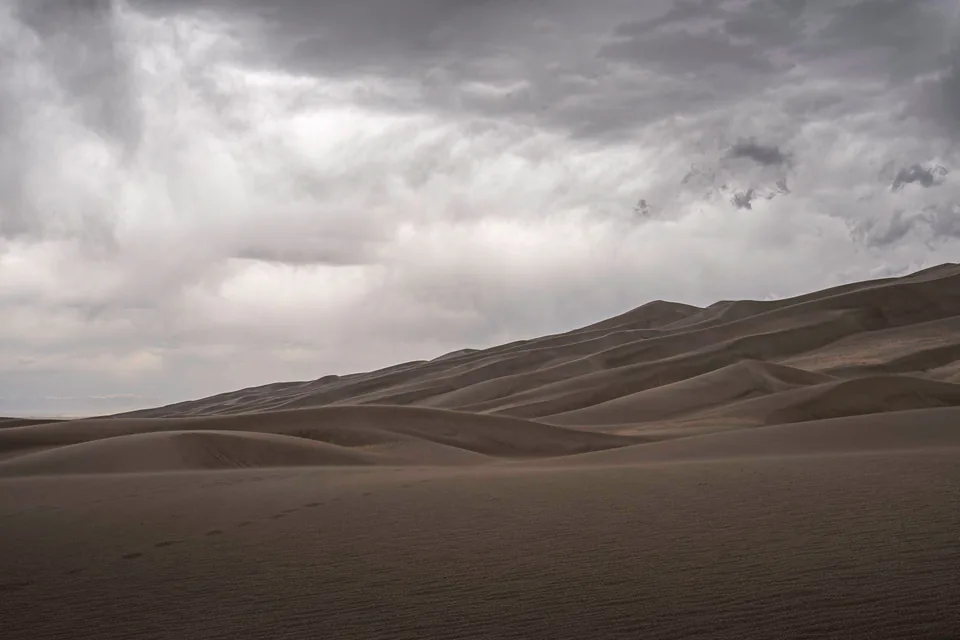 Dunes under a heavy overcast sky