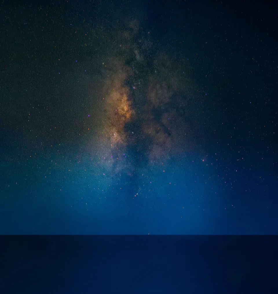 Milky Way over the sea in deep blue