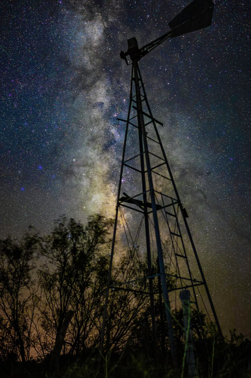 Windmill silhouetted against the Milky Way