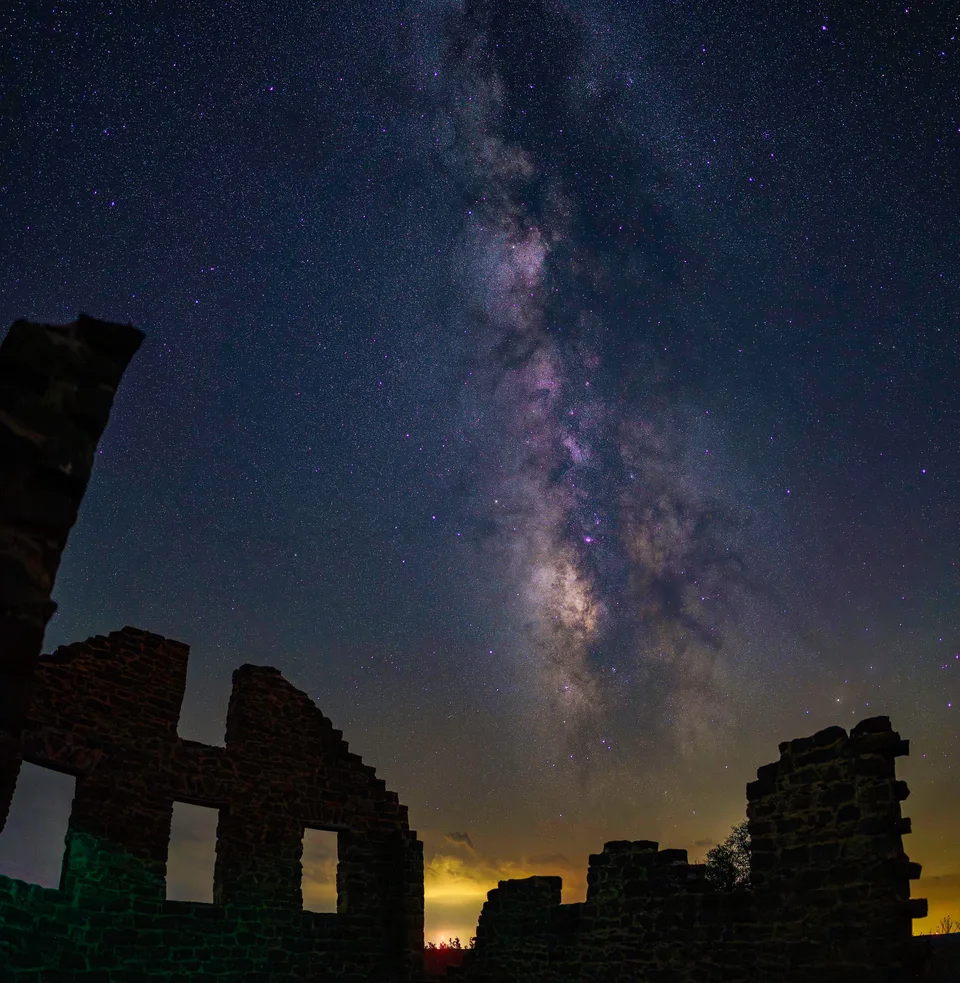 Milky Way rising above stone ruins